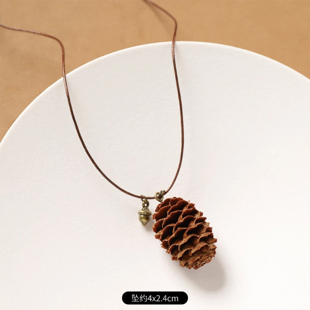 Vintage bohemian ethnic necklace with round natural stone pendant, featuring earthy brown tones and cord design, displayed on a neutral background with linen accent, ideal for boho fashion enthusiasts 06