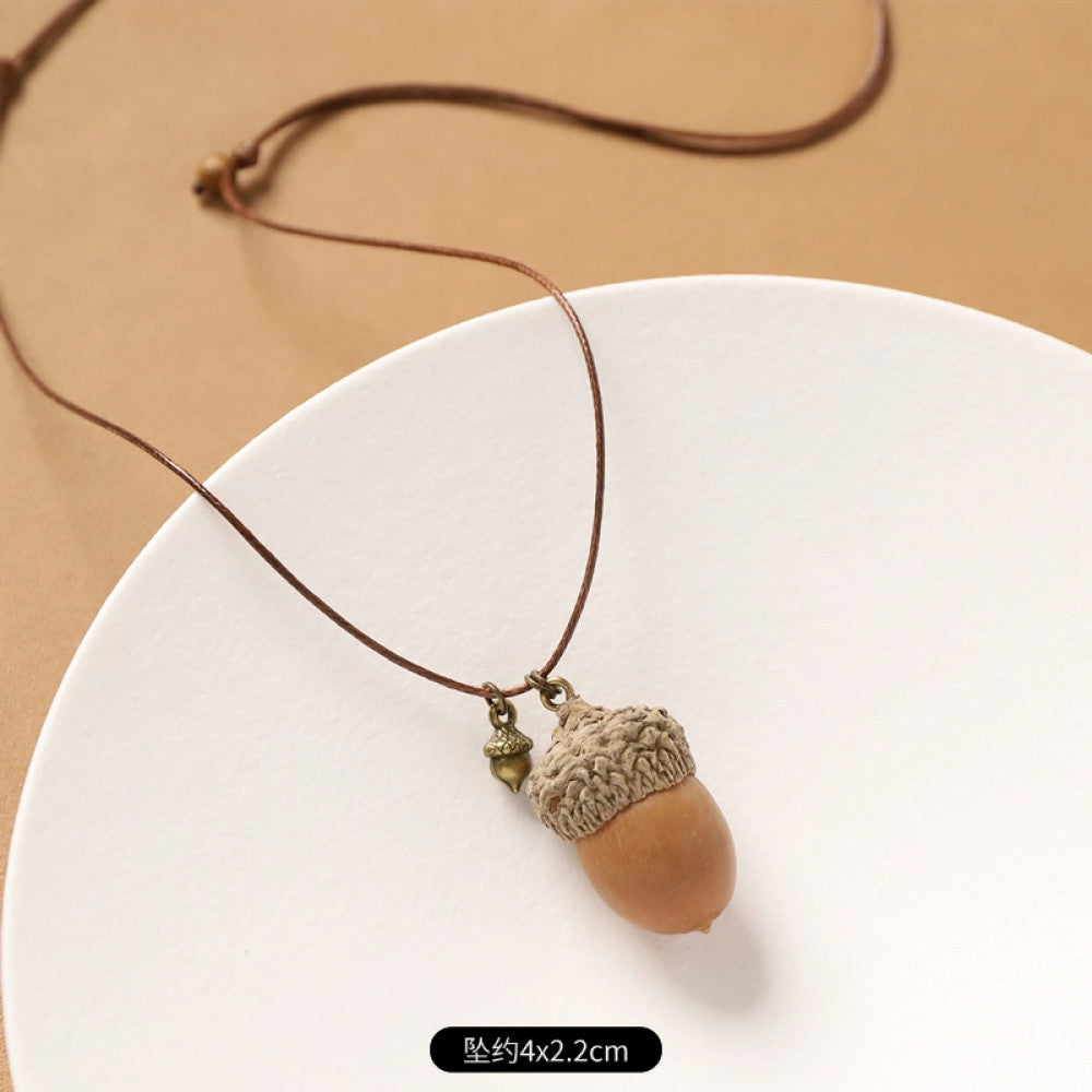 Vintage bohemian ethnic necklace with round natural stone pendant, featuring earthy brown tones and cord design, displayed on a neutral background with linen accent, ideal for boho fashion enthusiasts 07