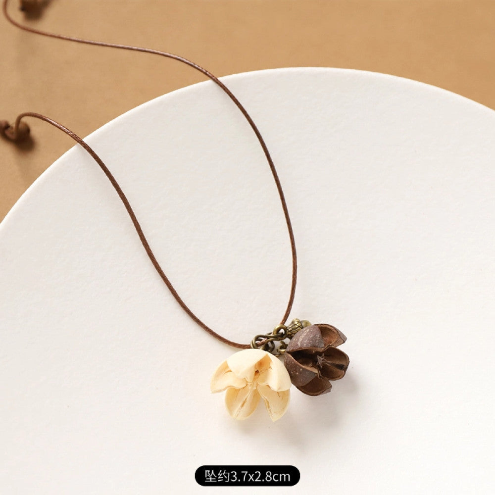 Vintage bohemian ethnic necklace with round natural stone pendant, featuring earthy brown tones and cord design, displayed on a neutral background with linen accent, ideal for boho fashion enthusiasts 08