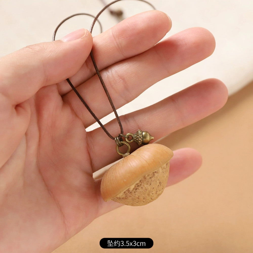 Vintage bohemian ethnic necklace with round natural stone pendant, featuring earthy brown tones and cord design, displayed on a neutral background with linen accent, ideal for boho fashion enthusiasts 10