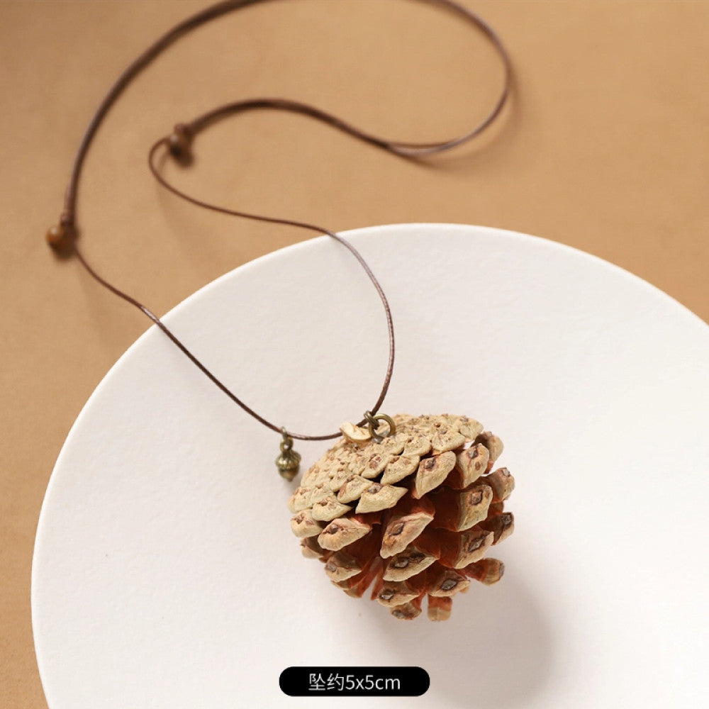 Vintage bohemian ethnic necklace with natural seed pendant, featuring earthy brown tones and cord design, displayed on a white plate against a neutral background, ideal for boho fashion enthusiasts 11