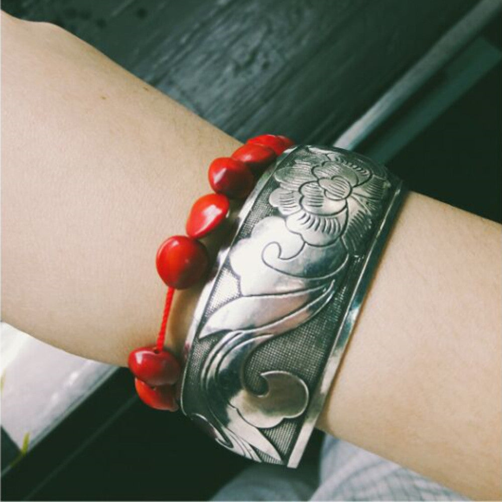 Assorted bohemian vintage ethnic silver-tone engraved cuff bracelet set with fish and floral motifs, displayed on a white hand model, ideal for boho and ethnic fashion enthusiasts 01