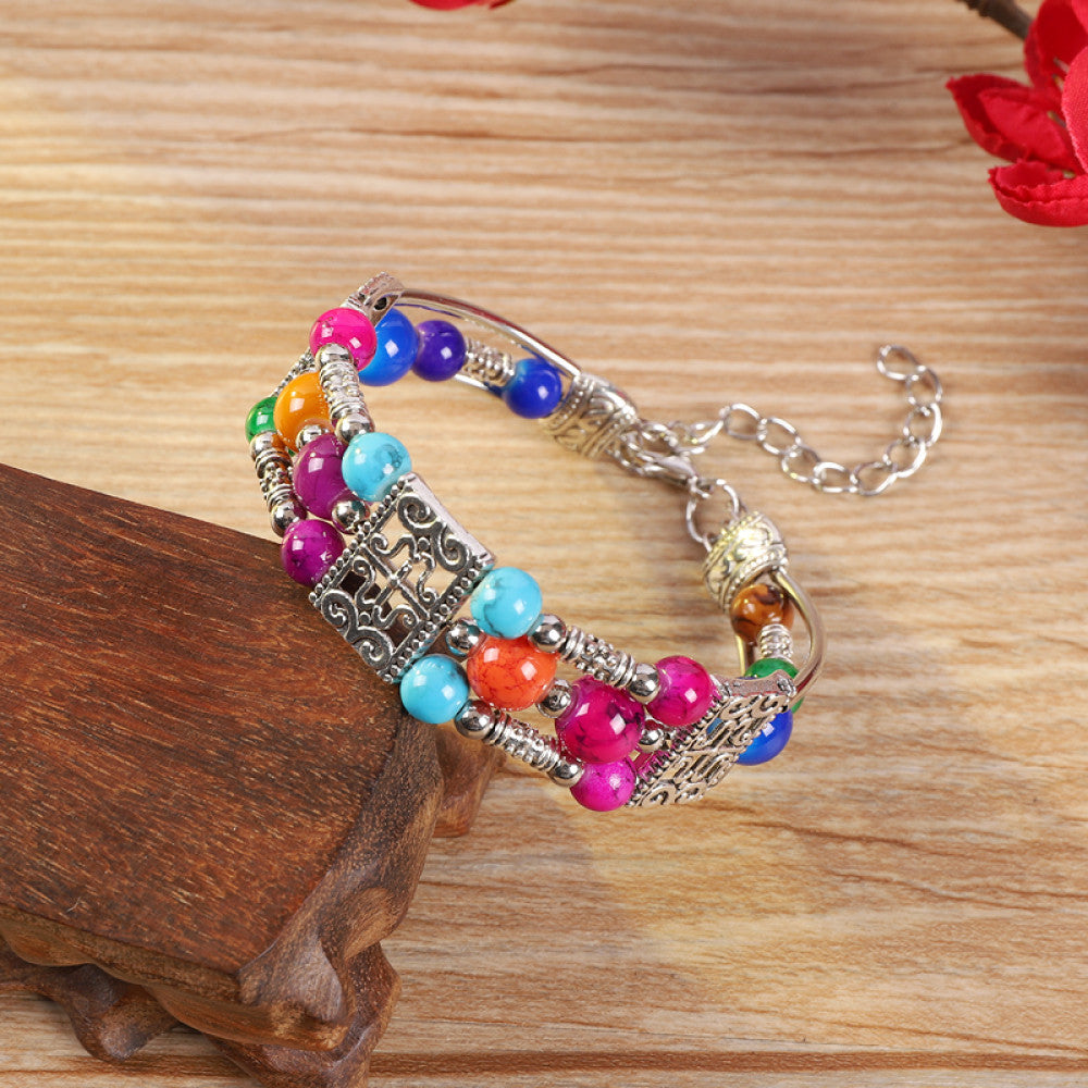 Vintage bohemian ethnic bracelet with turquoise beads and silver leaf accents, displayed on a wooden surface, ideal for boho fashion enthusiasts 02