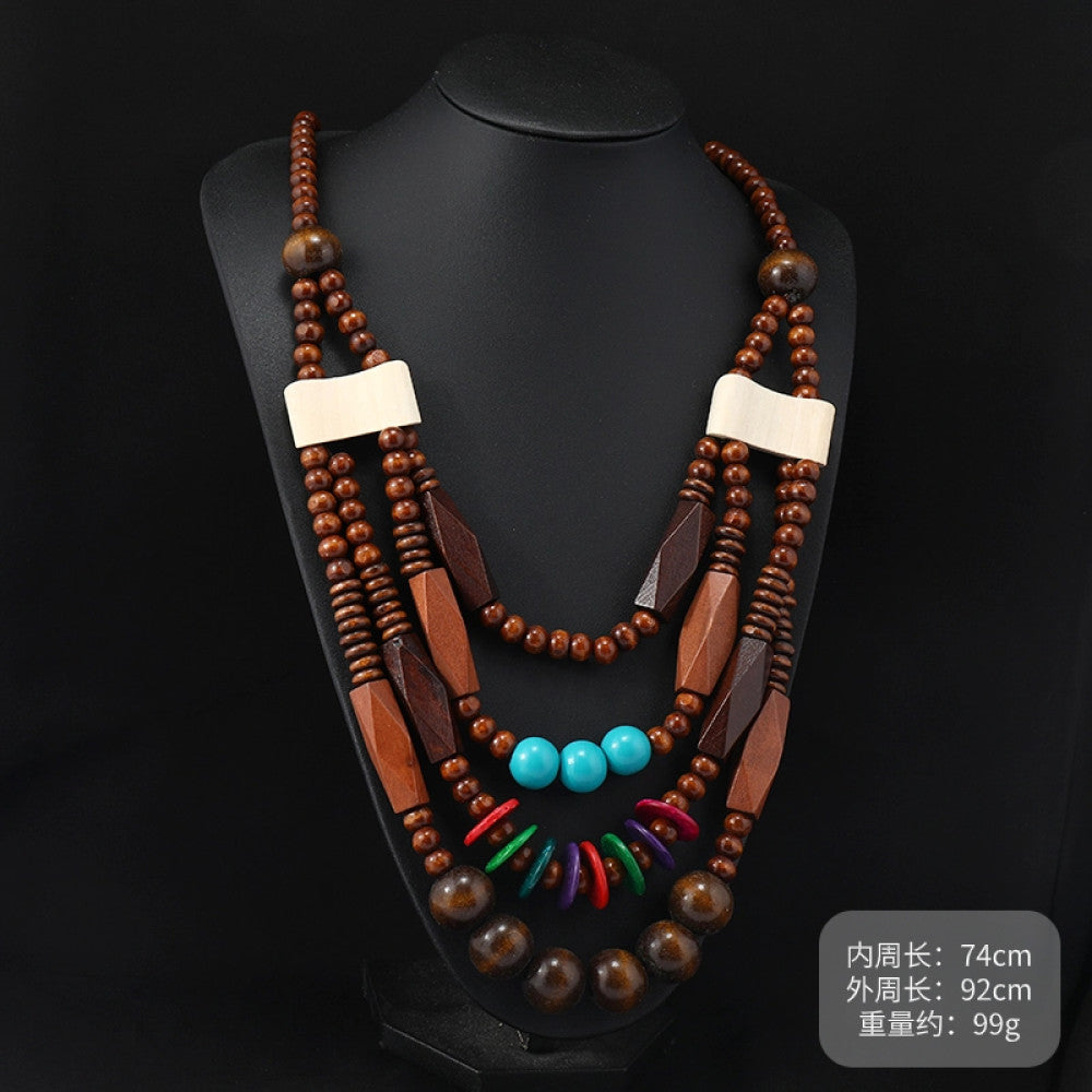 Vintage bohemian multi-layer wood beaded necklace with turquoise and colorful accents, featuring intricate layered design, ideal for ethnic tribal and boho fashion, displayed on a black mannequin against a dark background