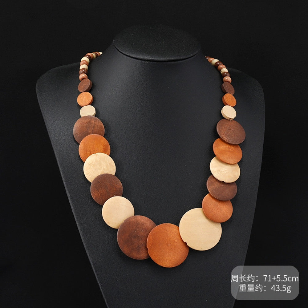 Vintage bohemian multi-layer wood beaded necklace with turquoise and colorful accents, featuring intricate layered design, ideal for ethnic tribal and boho fashion, displayed on a black mannequin against a dark background 01