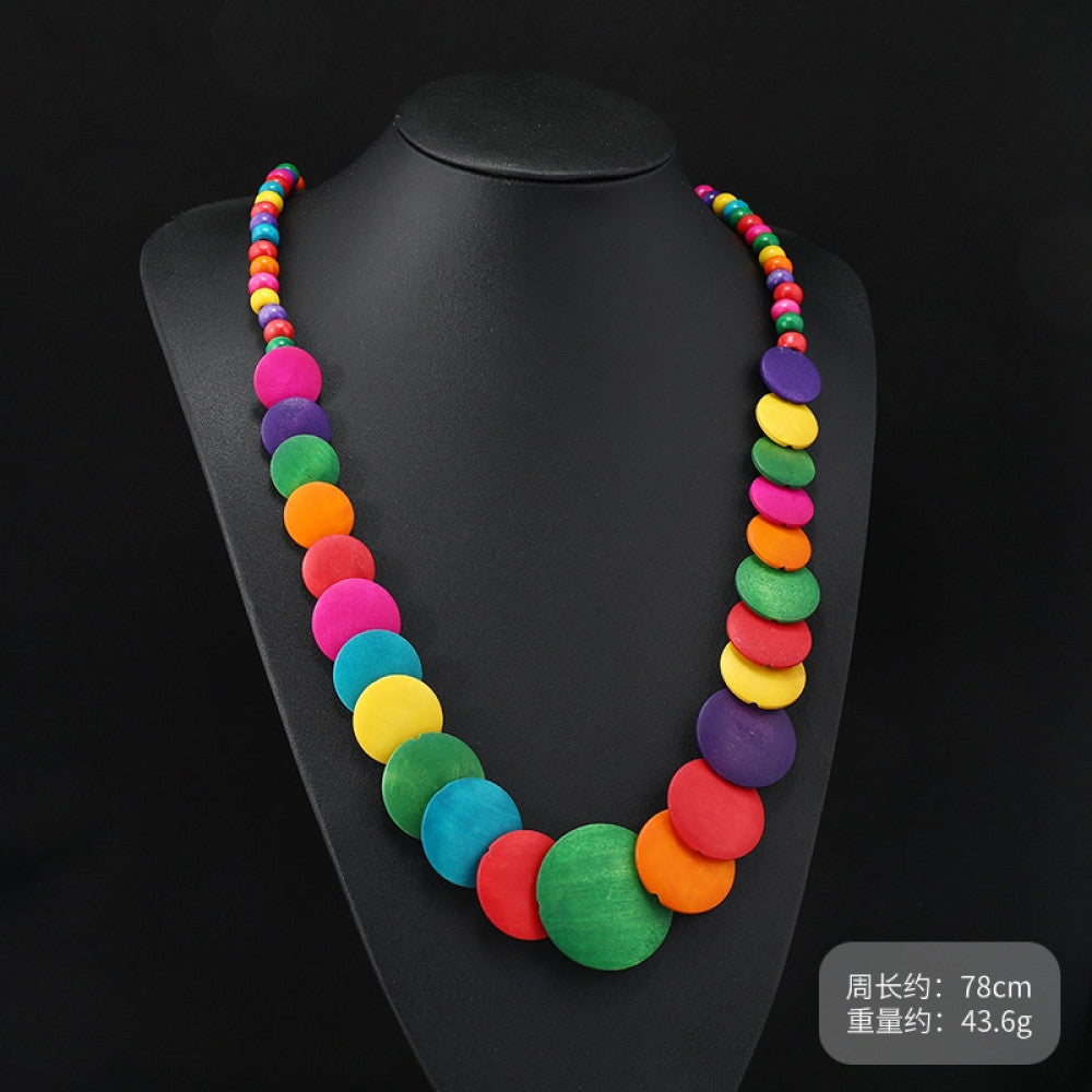 Vintage bohemian multi-layer wood beaded necklace with turquoise and colorful accents, featuring intricate layered design, ideal for ethnic tribal and boho fashion, displayed on a black mannequin against a dark background 07