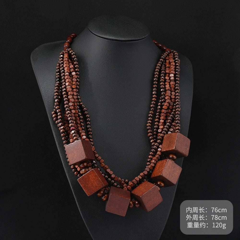 Vintage bohemian multi-layer wood beaded necklace with turquoise and colorful accents, featuring intricate layered design, ideal for ethnic tribal and boho fashion, displayed on a black mannequin against a dark background 09