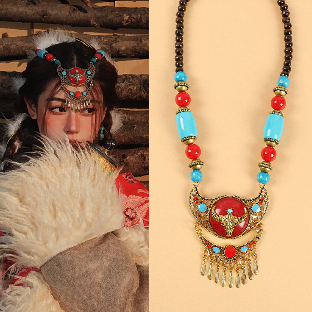 Ethnic tribal style necklace with large red pendant, colorful beaded design, and tassel details, ideal for bohemian vintage fashion, displayed alongside a model in traditional ethnic attire 07