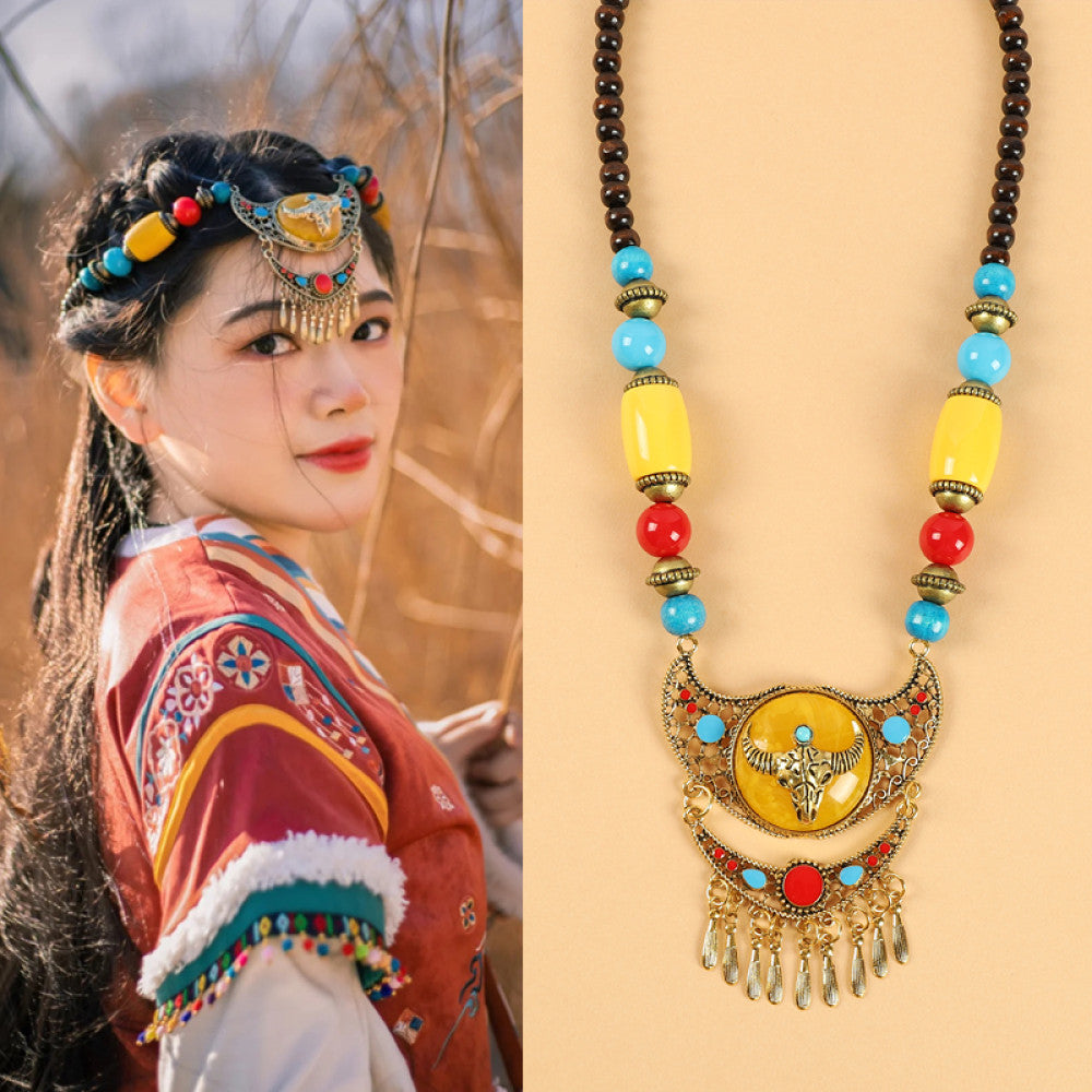 Ethnic tribal style necklace with large yellow pendant, colorful beaded design, and tassel details, ideal for bohemian vintage fashion, displayed alongside a model in traditional ethnic attire 06