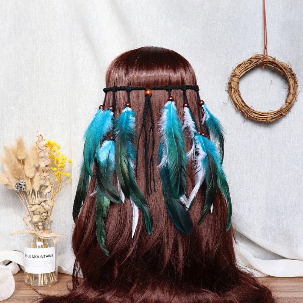 Boho bohemian macramé hair band (worn on long dark brown hair) featuring abundant white feather tassels, wooden bead accents, displayed with dried flower vase & woven wreath decor 01