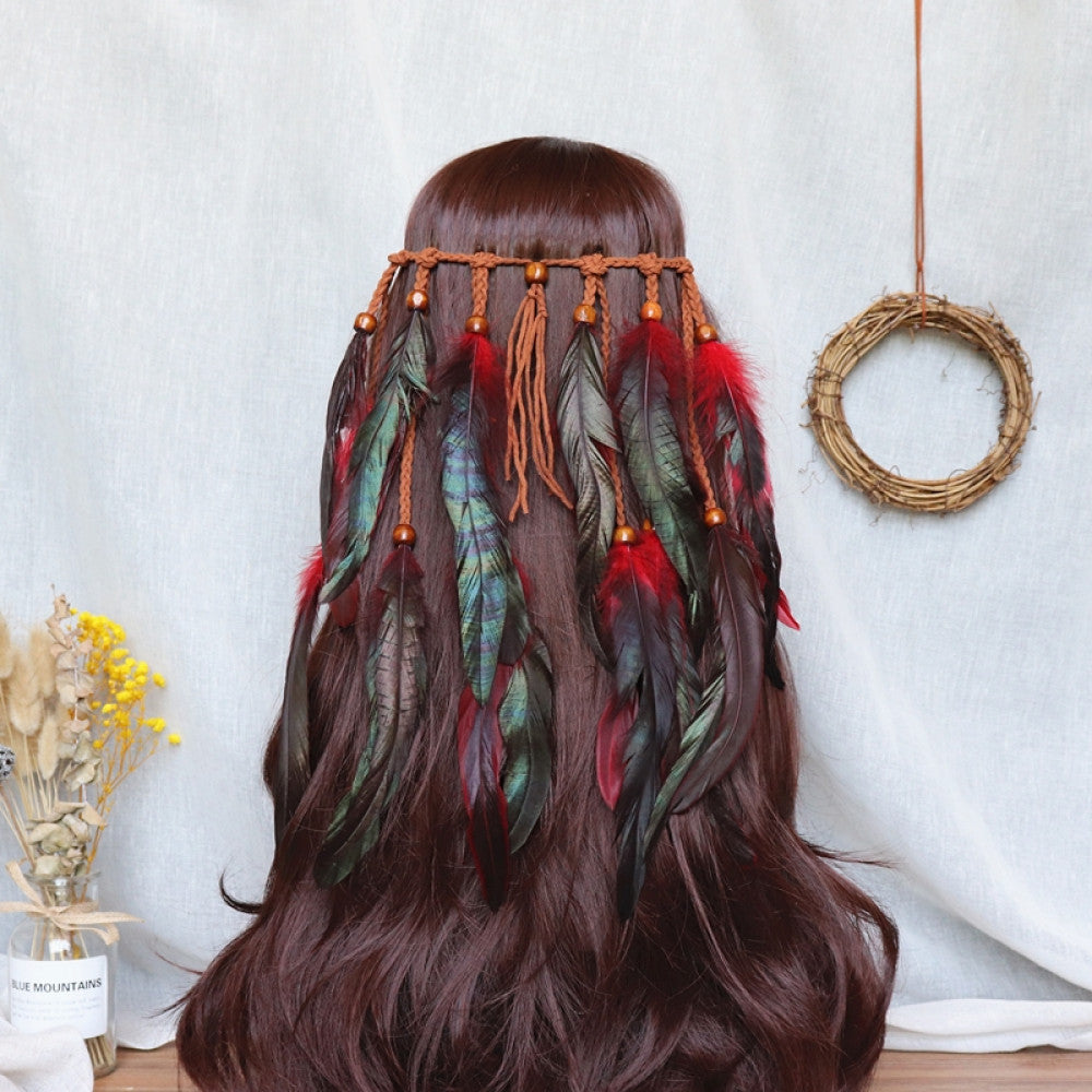 Boho bohemian macramé hair band (worn on long dark brown hair) featuring abundant white feather tassels, wooden bead accents, displayed with dried flower vase & woven wreath decor 02