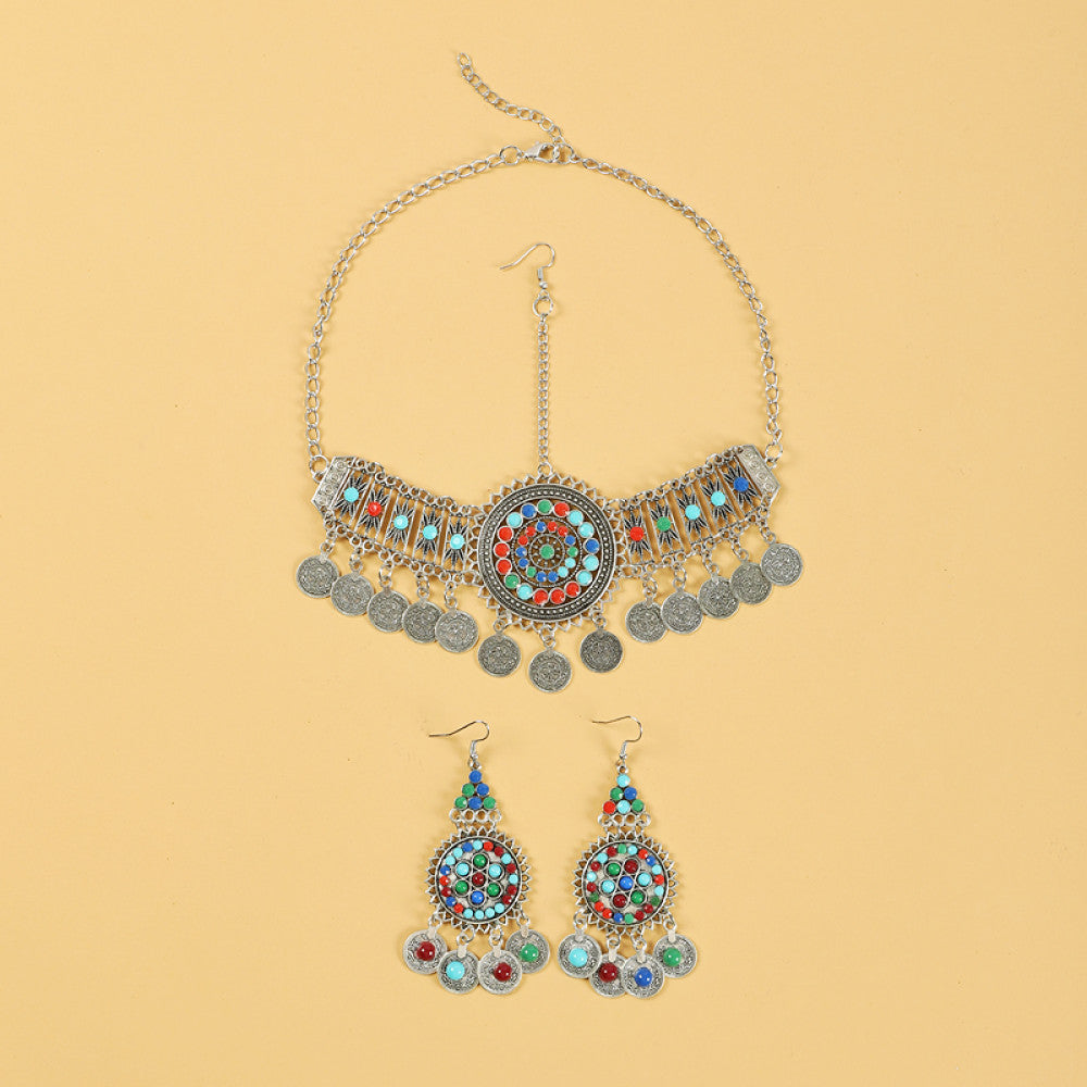 Boho ethnic silver-tone choker necklace featuring a vibrant colorful mosaic centerpiece, turquoise/gemstone decorative accents, and layered coin tassel pendants, displayed on a light yellow background, ideal for bohemian and festival fashion enthusiasts in the US 01