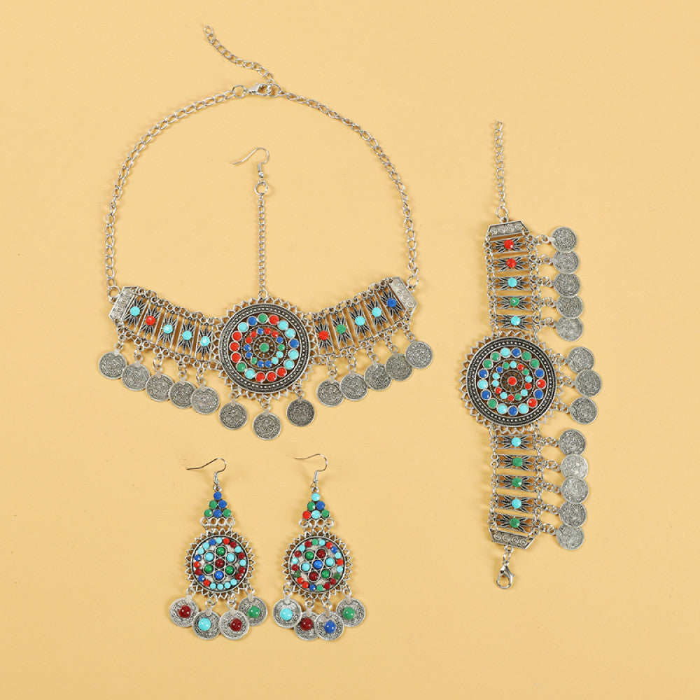 Boho ethnic silver-tone choker necklace featuring a vibrant colorful mosaic centerpiece, turquoise/gemstone decorative accents, and layered coin tassel pendants, displayed on a light yellow background, ideal for bohemian and festival fashion enthusiasts in the US 02
