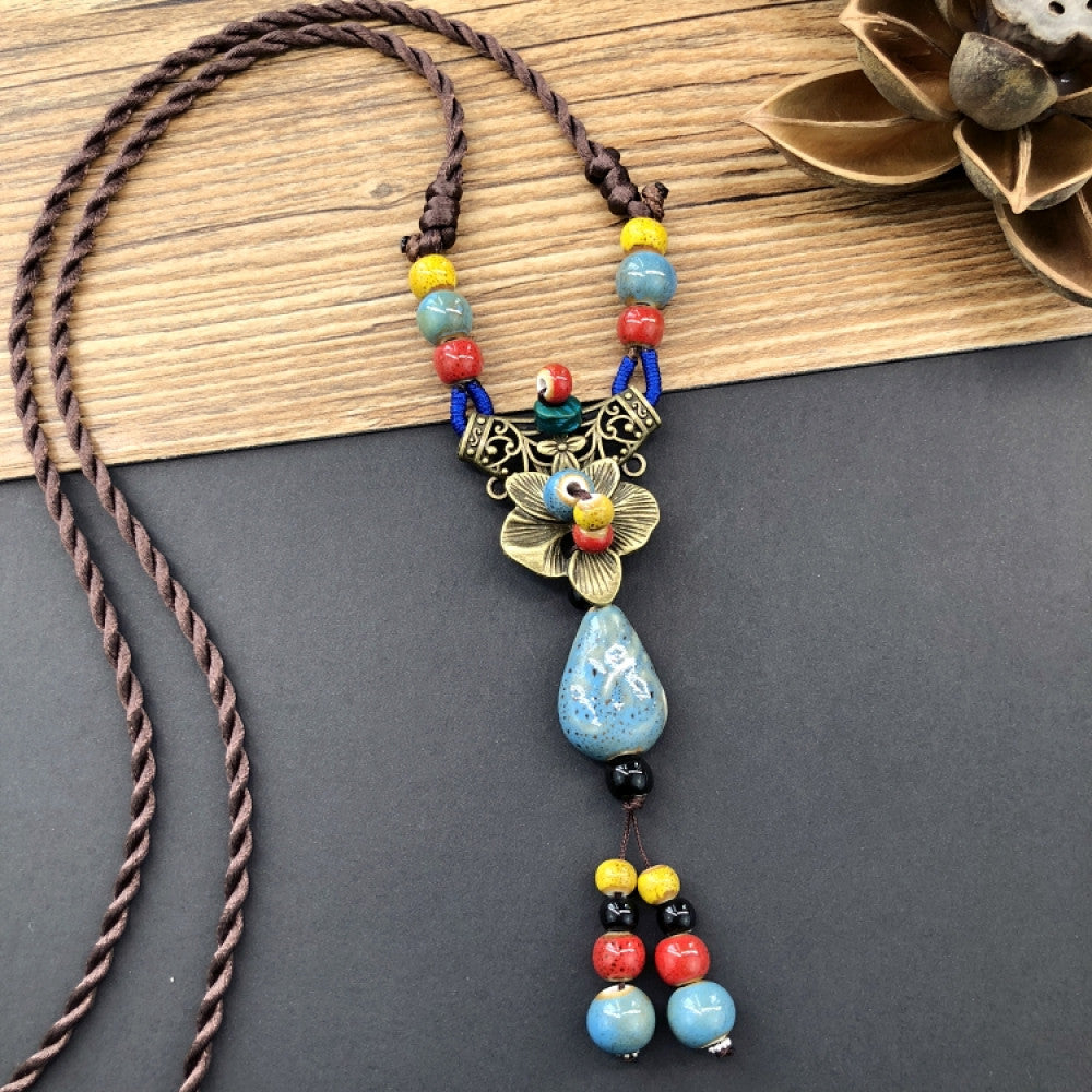 Handmade boho ceramic beaded pendant necklace with colorful beads and vintage ethnic floral design