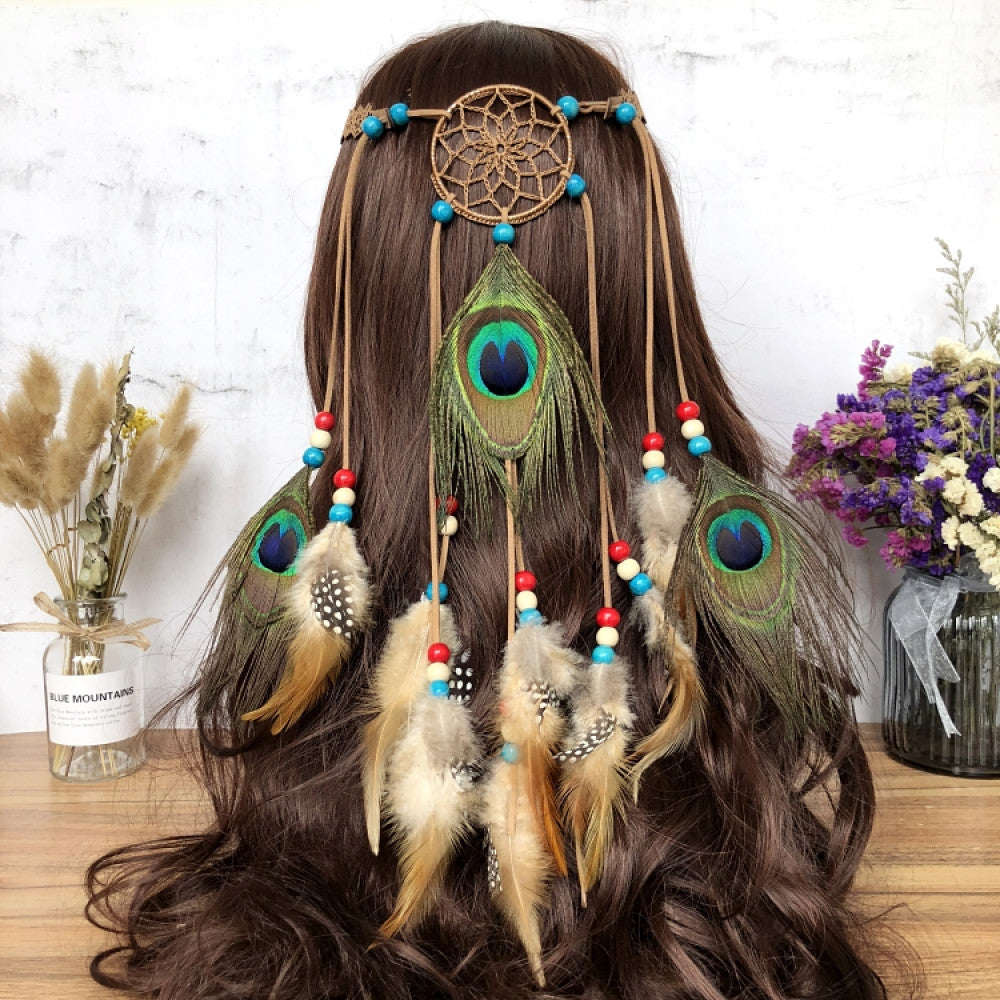 Boho leather cord hair band featuring a vibrant peacock feather, multi color feather tassels, and bead accents  displayed on a wooden surface with dried fresh flower arrangements, ideal for bohemian festival fashion enthusiasts in the US 03