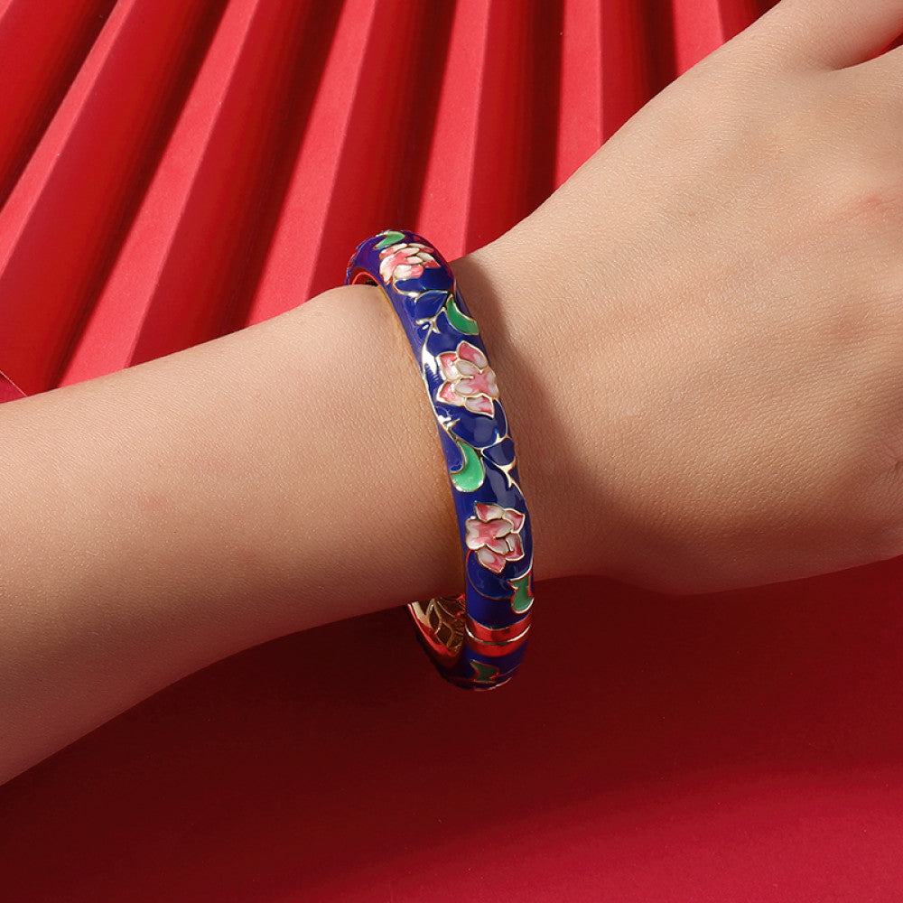 Boho vintage Chinese cloisonné enamel bangle with pink floral design and gold plating, styled on red background, ideal for ethnic and bohemian fashion enthusiasts in the US 04