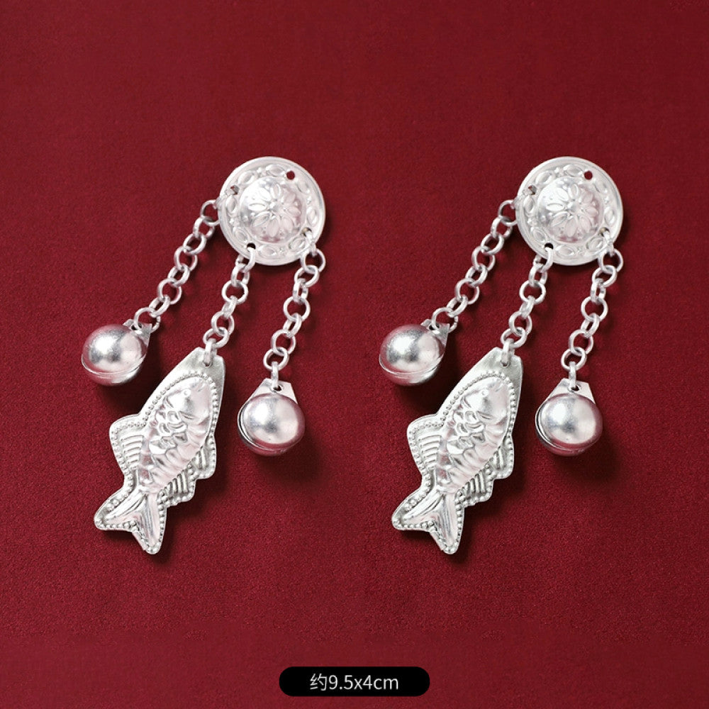 Boho vintage ethnic 2-piece silver-tone decorative ornament set (displayed on a rich red velvet background) featuring butterfly, lotus details, plus fish-shaped and pearl tassel pendants, ideal for bohemian retro or traditional hair/clothing styling in the US 03