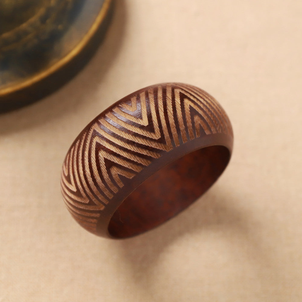 Boho vintage ethnic black bangle with sun motif filigree designs, styled on neutral surface, ideal for bohemian and tribal fashion enthusiasts in the US 02