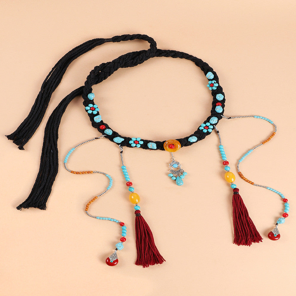 Boho vintage ethnic black braided choker necklace (displayed on a soft beige background) featuring turquoise bead details, a yellow decorative piece, and red tassel pendants, ideal for bohemian retro fashion styling in the US