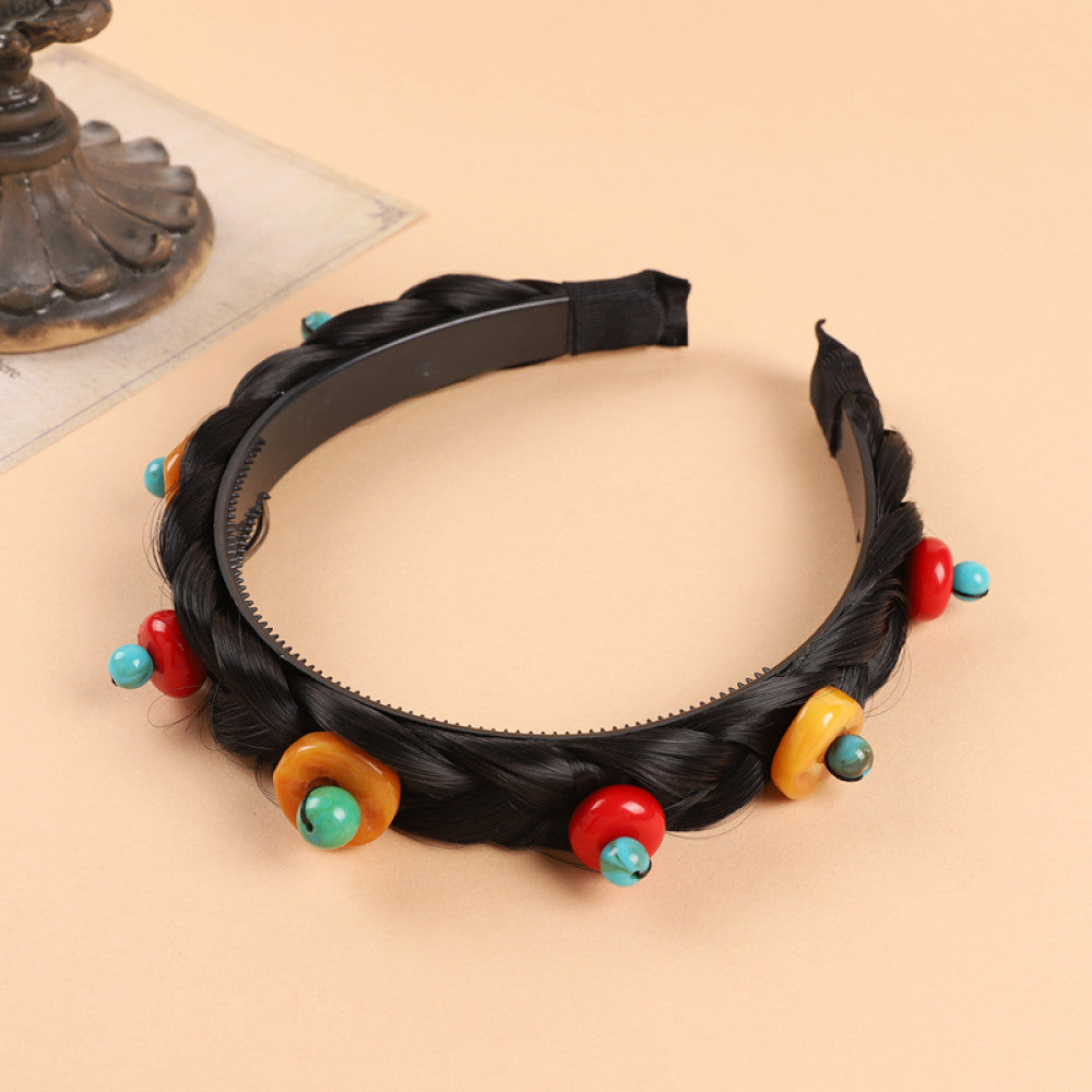 Boho vintage ethnic black braided hair hoop headband featuring a prominent gold ornament, plus red, turquoise, and yellow bead details, ideal for bohemian retro ethnic fashion styling in the US 01