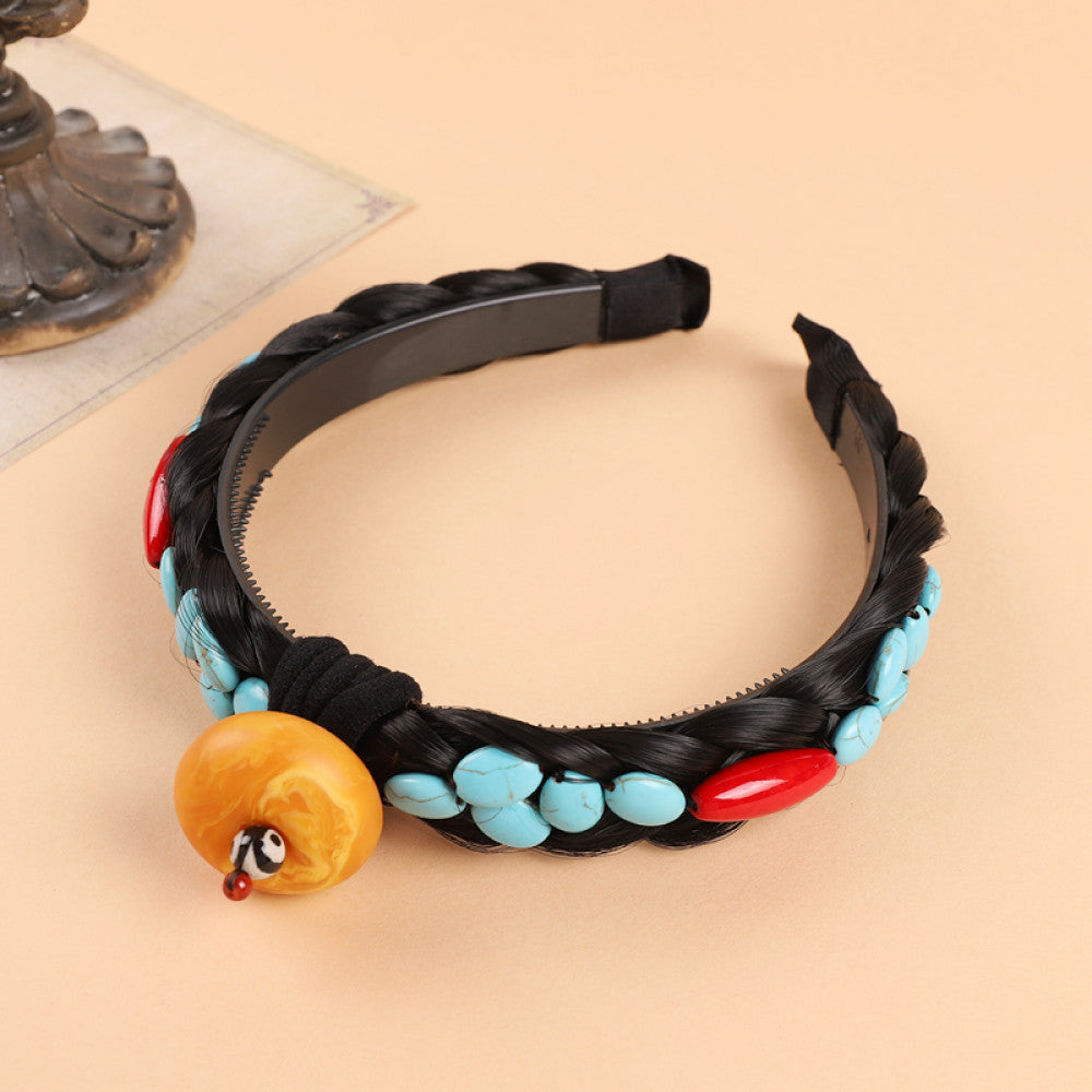 Boho vintage ethnic black braided hair hoop headband featuring a prominent gold ornament, plus red, turquoise, and yellow bead details, ideal for bohemian retro ethnic fashion styling in the US 02
