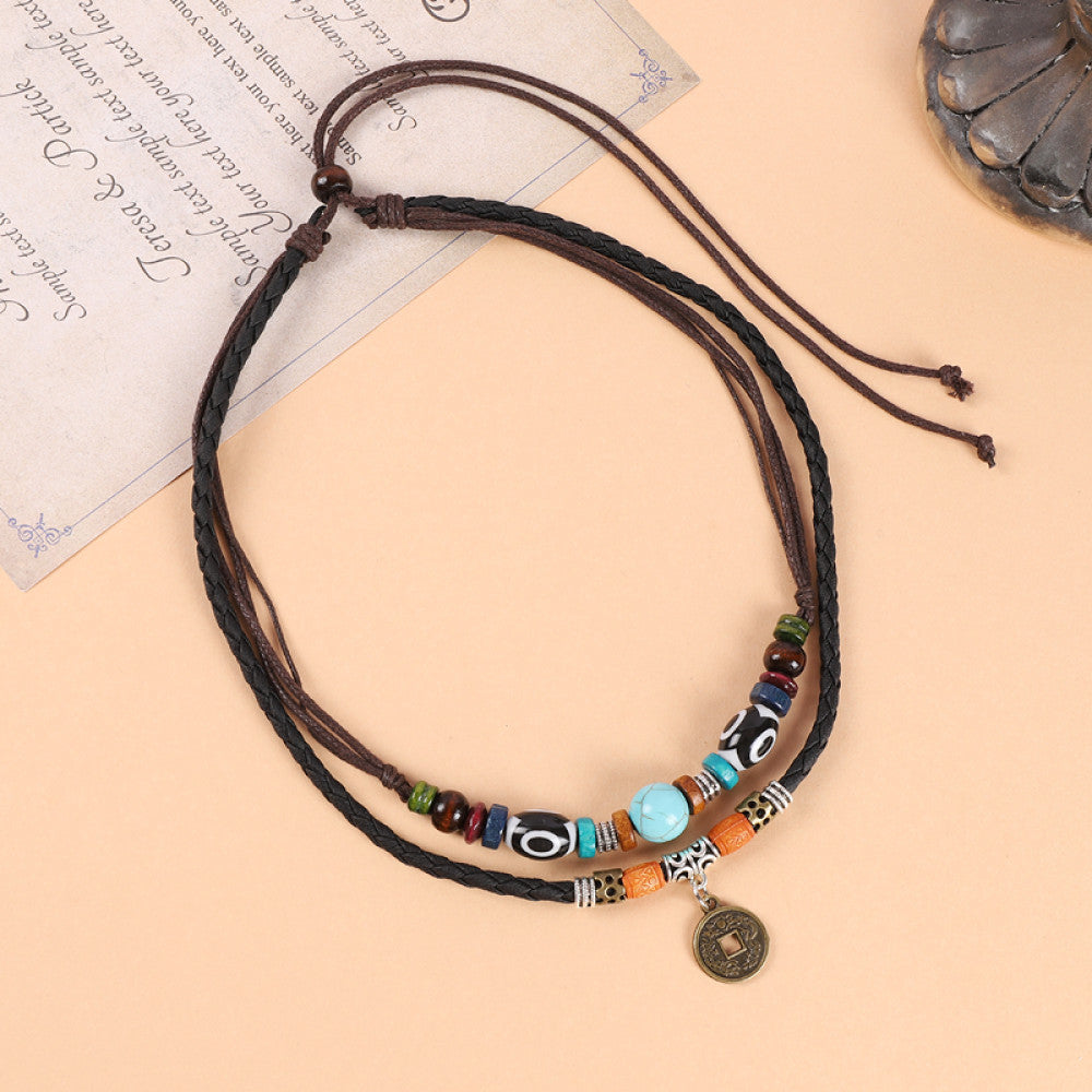 Boho vintage ethnic double-layer leather cord choker necklace featuring mixed colorful beads, a turquoise accent piece, and a small decorative pendant