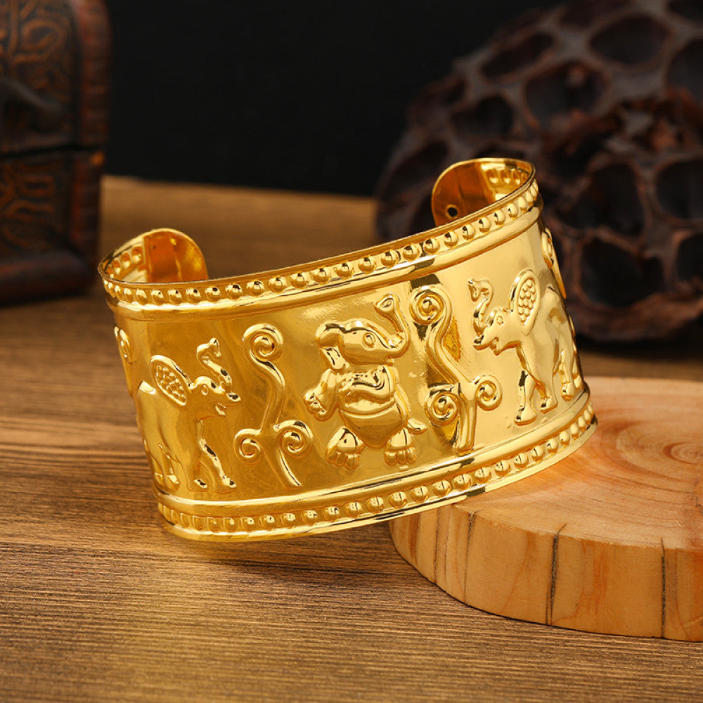 Boho vintage ethnic engraved gold cuff bangle with geometric designs, styled on wooden surface, ideal for bohemian and tribal fashion enthusiasts 03