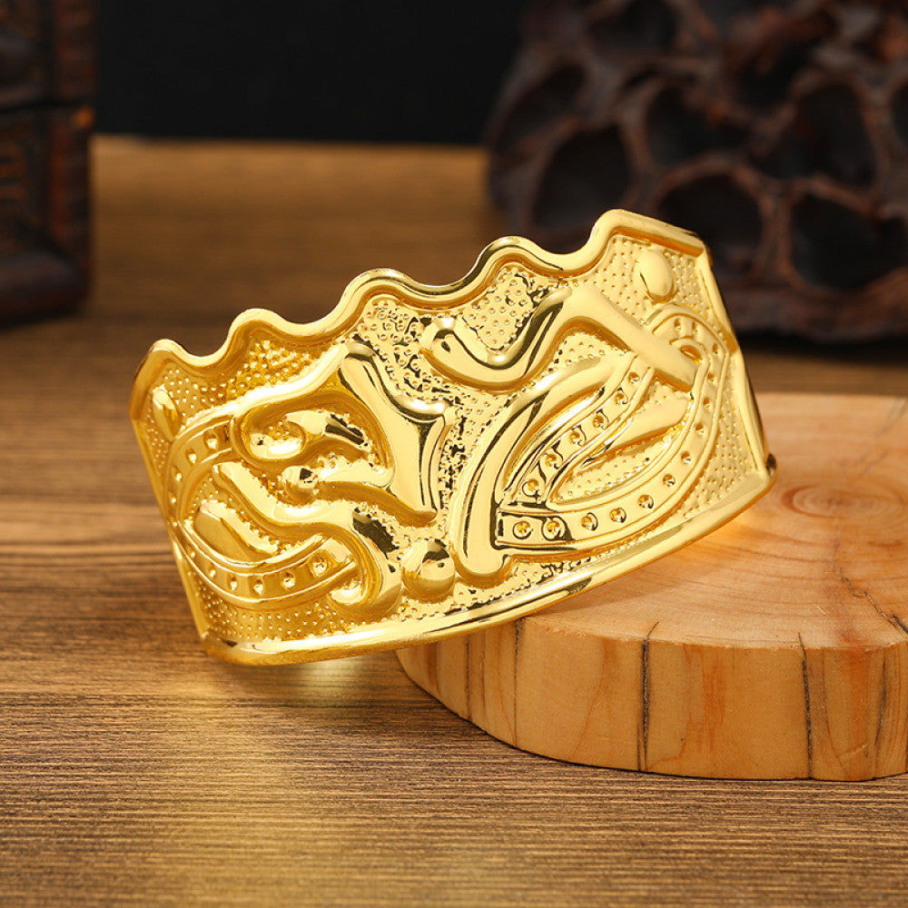 Boho vintage ethnic engraved gold cuff bangle with geometric designs, styled on wooden surface, ideal for bohemian and tribal fashion enthusiasts 13