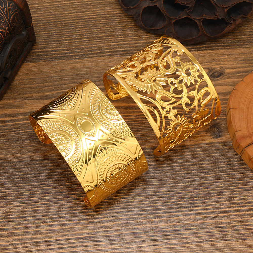 Boho vintage ethnic gold cuff bangle set with intricate engraved and filigree designs, styled on wooden surface, ideal for bohemian and tribal fashion enthusiasts