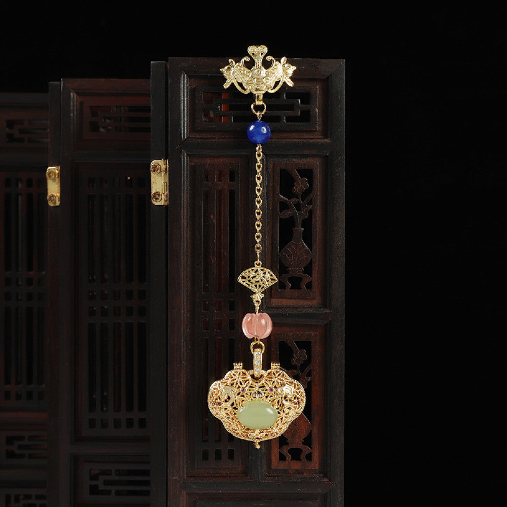 Boho vintage ethnic gold hair pendant featuring a jade-inlaid lock charm, blue/pink bead accents and intricate gold details, styled on a wooden display hook, ideal for bohemian and traditional fashion enthusiasts in the US 01