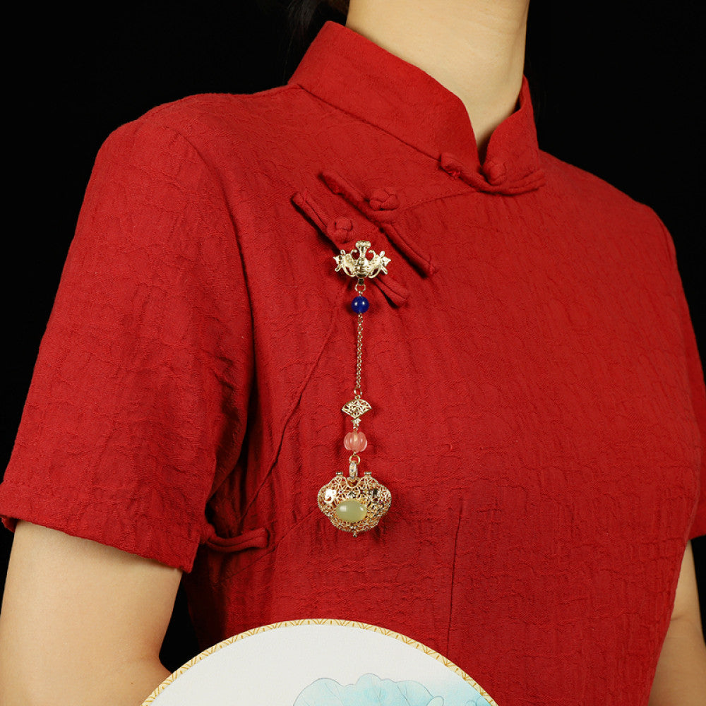 Boho vintage ethnic gold hair pendant featuring a jade-inlaid lock charm, blue/pink bead accents and intricate gold details, styled on a wooden display hook, ideal for bohemian and traditional fashion enthusiasts in the US 02