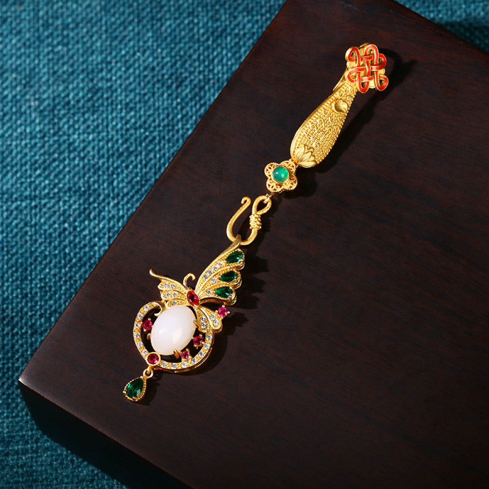 Boho vintage ethnic gold statement pendant featuring Chinese knot, peacock charm and colorful gemstone accents, styled on a tree branch, ideal for bohemian and traditional fashion enthusiasts in the US 03