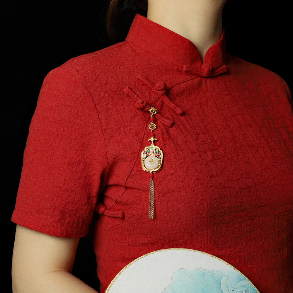 Boho vintage ethnic gold statement pendant featuring fu character, colorful enamel details, white gemstone center and gold tassel, styled on a tree branch, ideal for bohemian and traditional fashion enthusiasts in the US 01