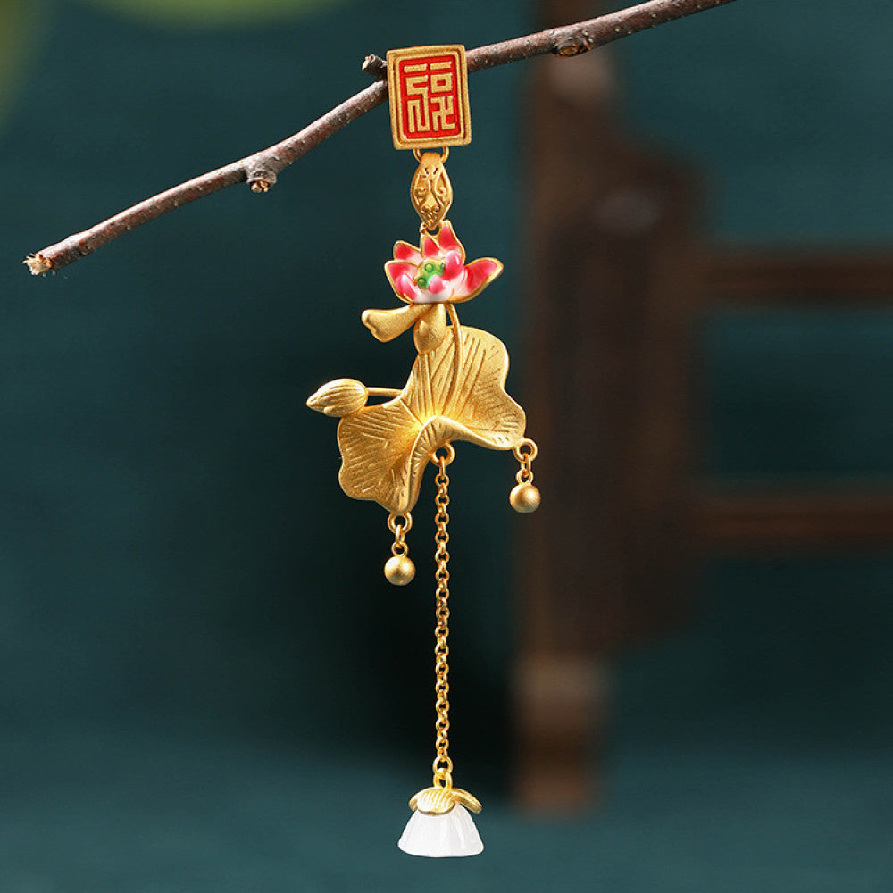 Boho vintage ethnic gold pendant featuring fu character, colorful floral charm and bell tassel details, styled on a tree branch, ideal for bohemian and traditional fashion enthusiasts in the US