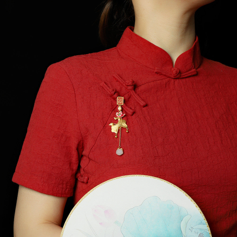 Boho vintage ethnic gold pendant featuring fu character, colorful floral charm and bell tassel details, styled on a tree branch, ideal for bohemian and traditional fashion enthusiasts in the US 01