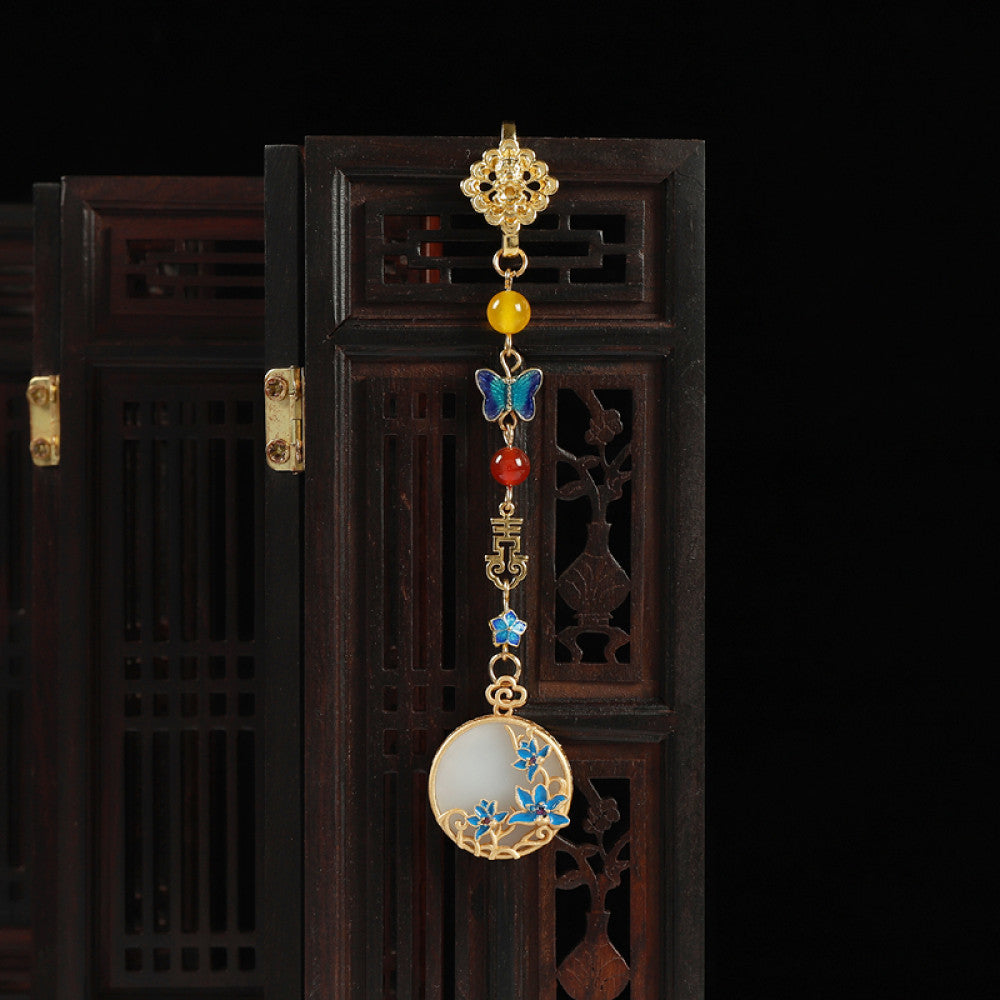 Boho vintage ethnic gold-tone hair pendant featuring butterfly decorative accent, Fu character detail, yellow/red/blue bead accents, and a white circular pendant with blue decorative detailing, styled on a wooden display hook against a black background, ideal for bohemian and traditional fashion enthusiasts in the US 02