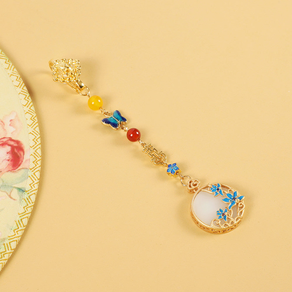 Boho vintage ethnic gold-tone hair pendant featuring butterfly decorative accent, Fu character detail, yellow/red/blue bead accents, and a white circular pendant with blue decorative detailing, styled on a wooden display hook against a black background, ideal for bohemian and traditional fashion enthusiasts in the US 05