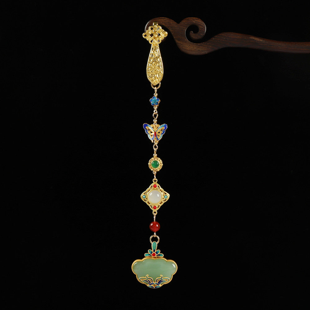 Boho vintage ethnic gold-tone hair pendant featuring multi-color gemstone (blue/green/red) accents, intricate enamel decorations, and a jade-inlaid ruyi lock-shaped pendant, styled on a wooden display hook against a black background, ideal for bohemian and traditional fashion enthusiasts in the US
