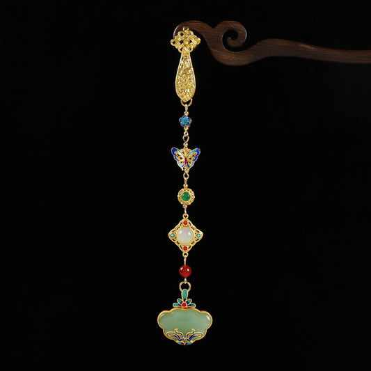 Boho vintage ethnic gold-tone hair pendant featuring multi-color gemstone (blue/green/red) accents, intricate enamel decorations, and a jade-inlaid ruyi lock-shaped pendant, styled on a wooden display hook against a black background, ideal for bohemian and traditional fashion enthusiasts in the US
