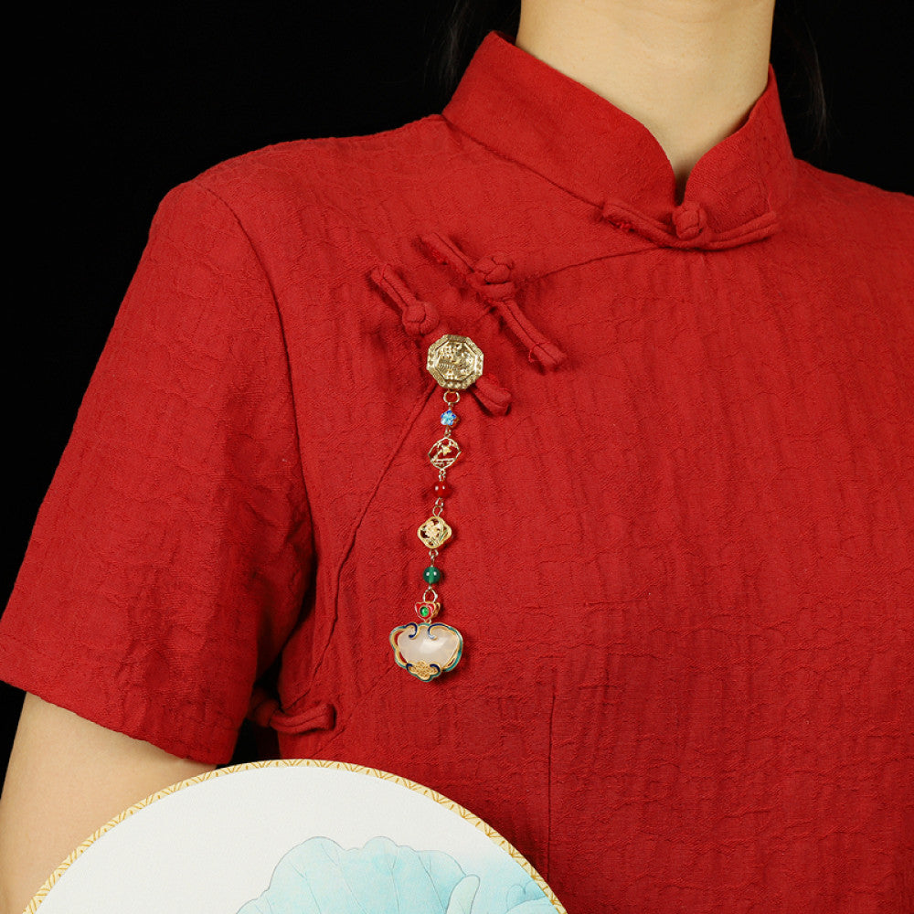 Boho vintage ethnic gold-tone hair pendant featuring intricate gold decorative clasp, blue/red/green gemstone accents, and an enamel-inlaid lock pendant with white texture, styled on a wooden display hook against a black background, ideal for bohemian and traditional fashion enthusiasts in the US 02