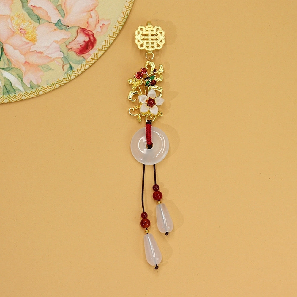 Boho vintage ethnic gold-tone hair pendant featuring double happiness charm, colorful floral details, white jade pendant and red bead tassels, styled on a wooden display hook, ideal for bohemian and traditional fashion enthusiasts in the US 03