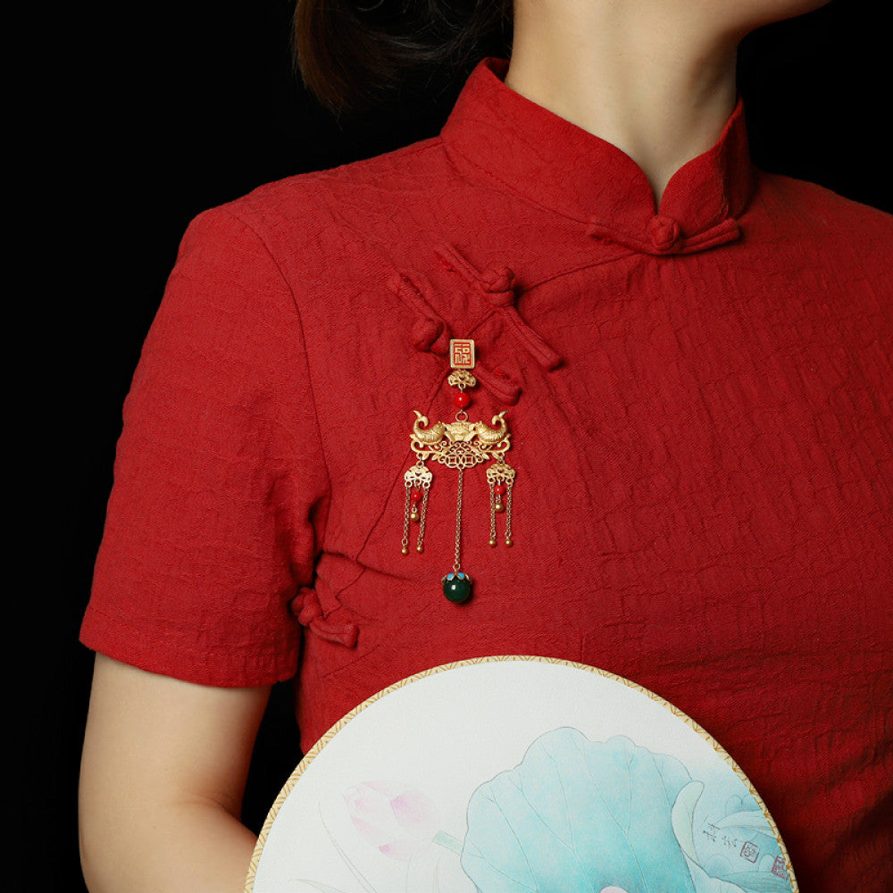 Boho vintage ethnic gold-tone hair pendant featuring red double happiness charm, intricate gold decorative details, red bead accents and a green beaded pendant, styled on a twig against a teal background, ideal for bohemian and traditional fashion enthusiasts in the US 01