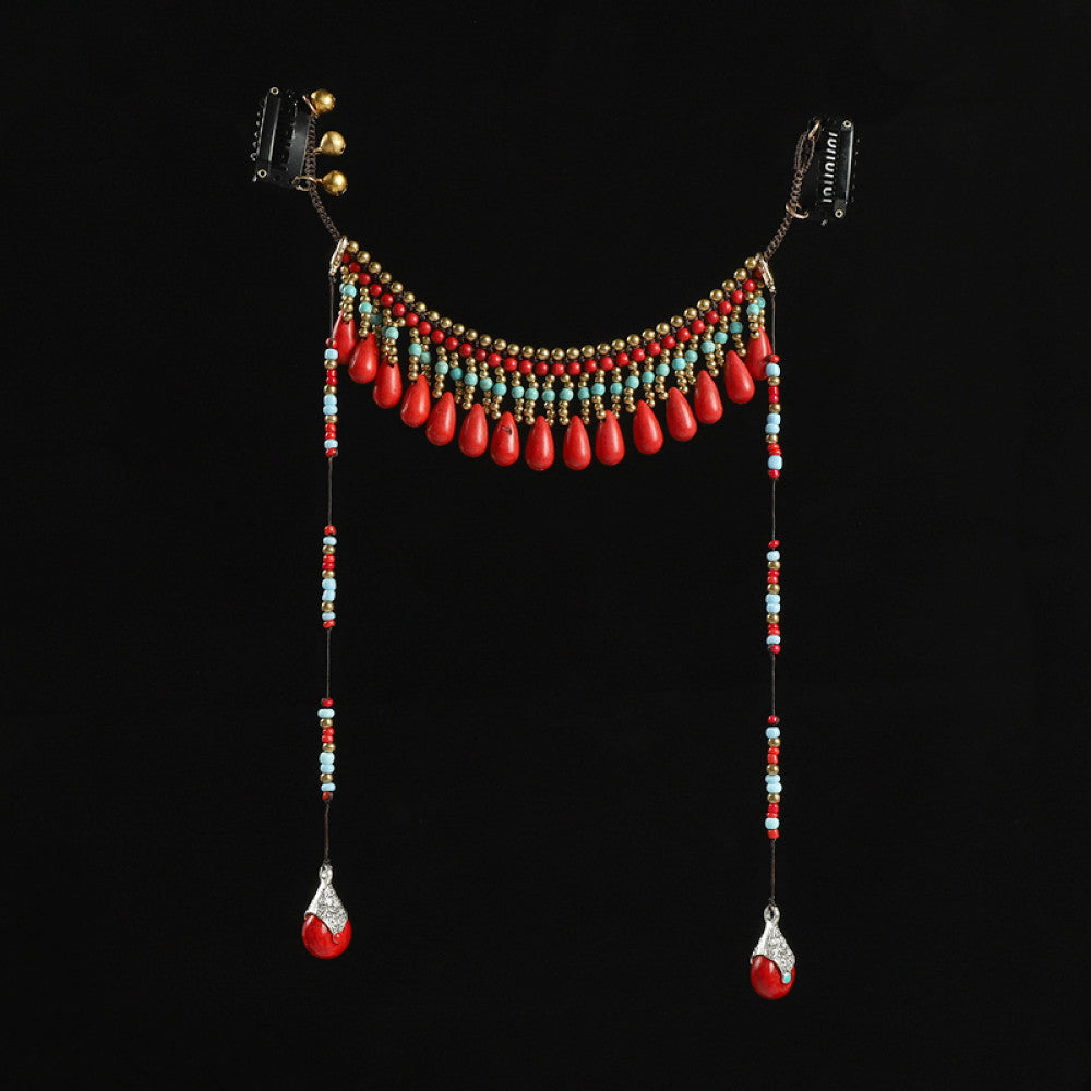 Boho vintage ethnic hair clip ornament featuring red coral-style beads, turquoise accents, and long dangle tassel pendants, displayed on a warm yellow background  02