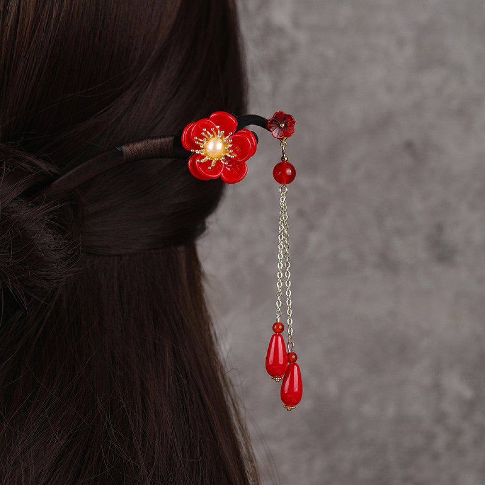 Boho vintage ethnic hair stick ornament featuring a pink flower green leaf accents, pink/green bead tassel, and light green leaf pendant, displayed against a muted gray background