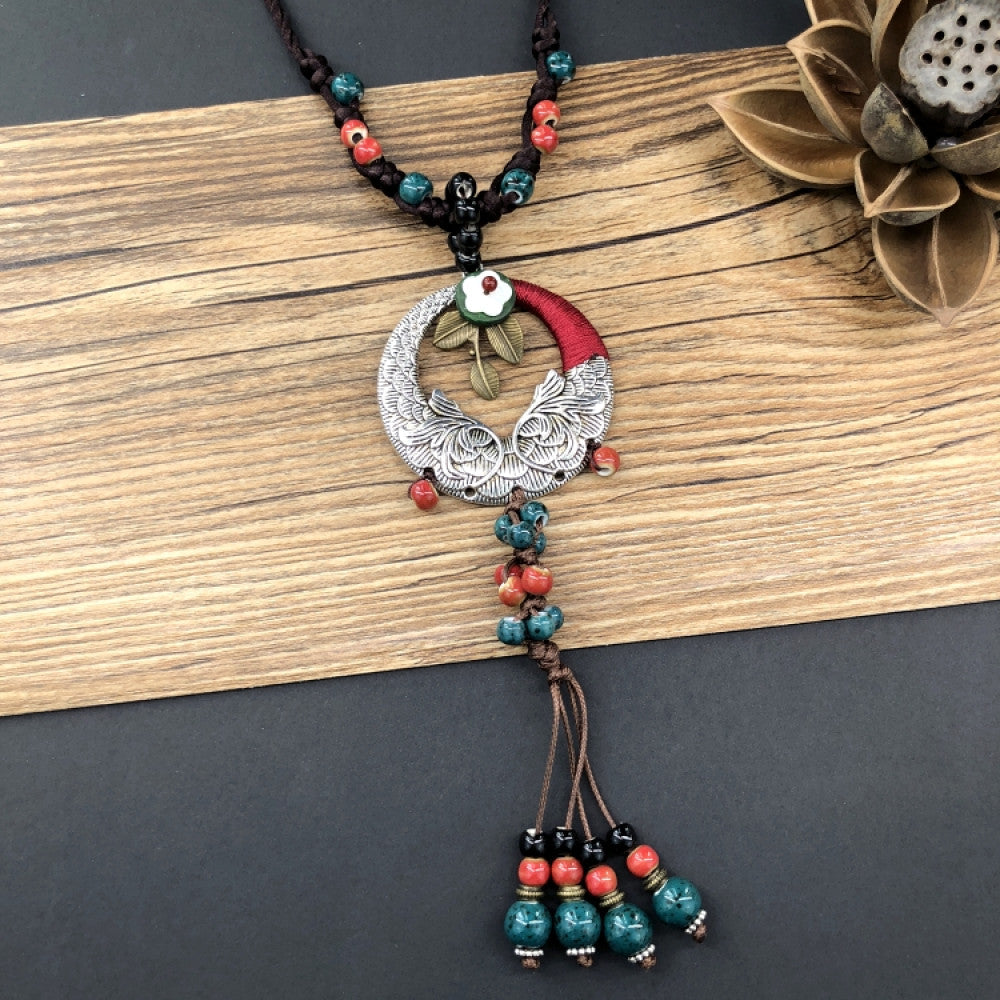 Boho vintage ethnic pendant necklace with colorful beads, engraved metal moon design and tassel