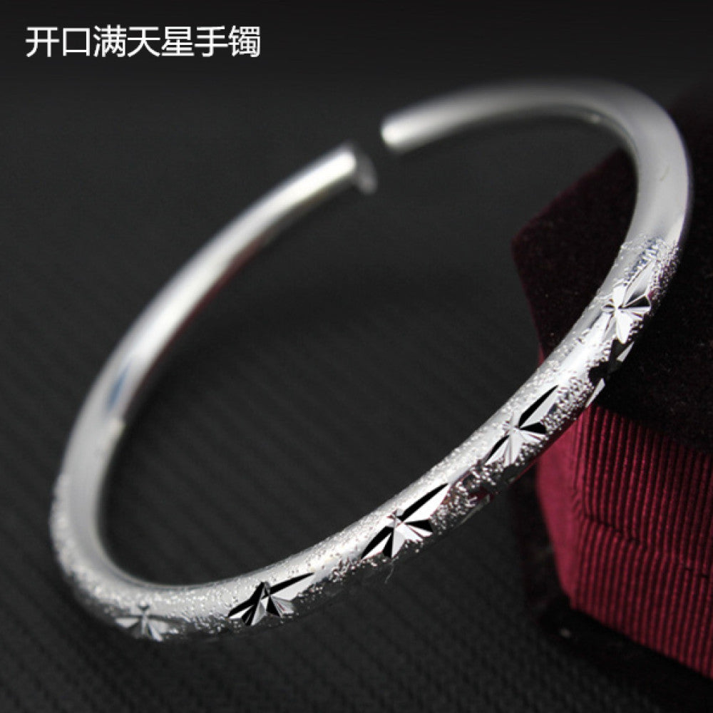 Boho vintage ethnic polished silver bangle, styled with traditional red and black decor, ideal for bohemian and minimalist fashion enthusiasts in the US 01