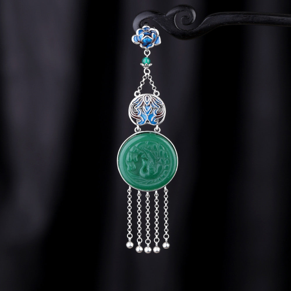Boho vintage ethnic silver hair pendant charm featuring a green carved gemstone and blue enamel accents, styled on a display hook, ideal for bohemian and traditional fashion enthusiasts in the US