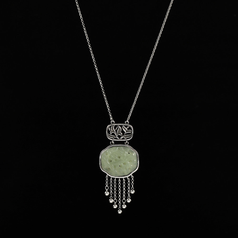 Boho vintage ethnic silver hair pendant with jade-inlaid openwork charm and silver tassel details, styled on a wooden display hook, ideal for bohemian and traditional fashion enthusiasts in the US 01