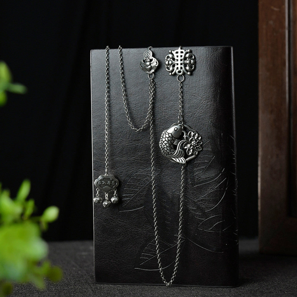 Boho vintage ethnic silver long chain statement pendant with carved charm and bell details, styled on a display hook, ideal for bohemian and traditional fashion enthusiasts in the US 01