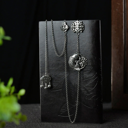 Boho vintage ethnic silver long chain statement pendant with carved charm and bell details, styled on a display hook, ideal for bohemian and traditional fashion enthusiasts in the US 01